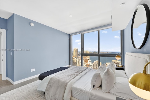 495 Brickell Ave Unit 3901, Miami, FL 33131 - bedroom with a water view, a view of city, and a wall of windows