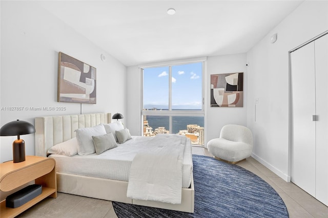 495 Brickell Ave Unit 3901, Miami, FL 33131 - bedroom featuring a water view and light tile patterned floors