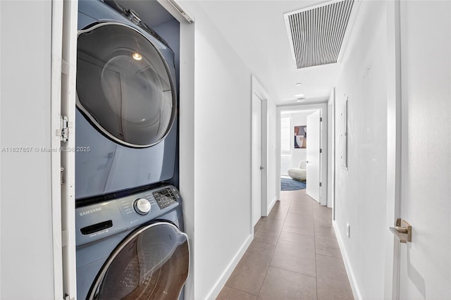 495 Brickell Ave Unit 3901, Miami, FL 33131 - laundry room with stacked washer / drying machine and tile patterned flooring