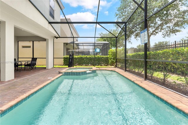 1892 Gobi Dr, Kissimmee, FL 3474 - view of swimming pool featuring a patio, a lanai, and a pool with connected hot tub