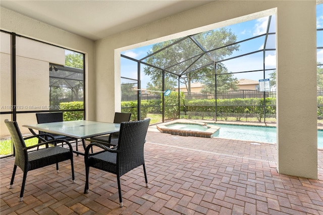 1892 Gobi Dr, Kissimmee, FL 3474 - view of patio with a lanai, a pool with connected hot tub, and outdoor dining area