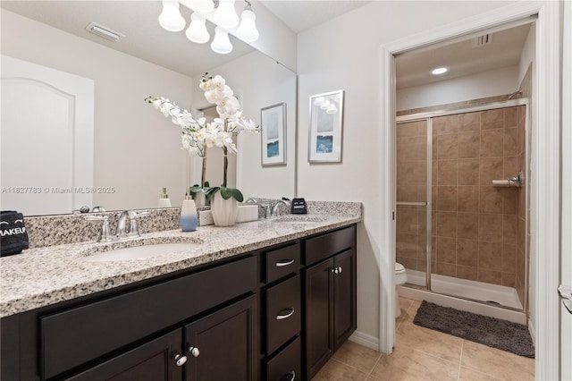 1892 Gobi Dr, Kissimmee, FL 3474 - full bath with double vanity, tile patterned floors, and a stall shower