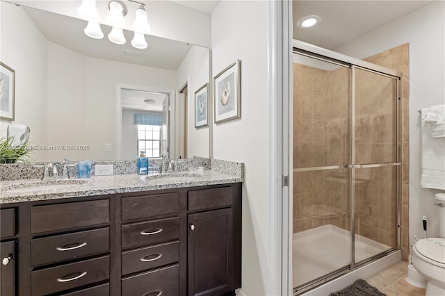 1892 Gobi Dr, Kissimmee, FL 3474 - bathroom featuring double vanity, tile patterned floors, and a shower stall