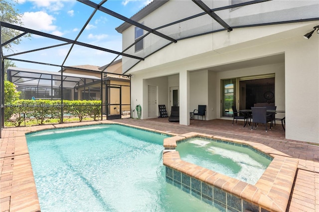 1892 Gobi Dr, Kissimmee, FL 3474 - view of swimming pool with a patio area, a pool with connected hot tub, and glass enclosure