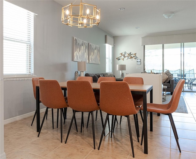1892 Gobi Dr, Kissimmee, FL 3474 - dining area with a chandelier, plenty of natural light, and light tile patterned floors