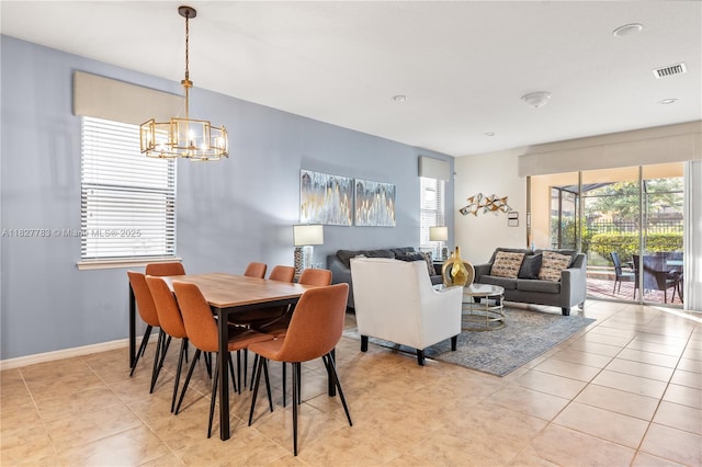1892 Gobi Dr, Kissimmee, FL 3474 - dining room featuring a chandelier and light tile patterned floors