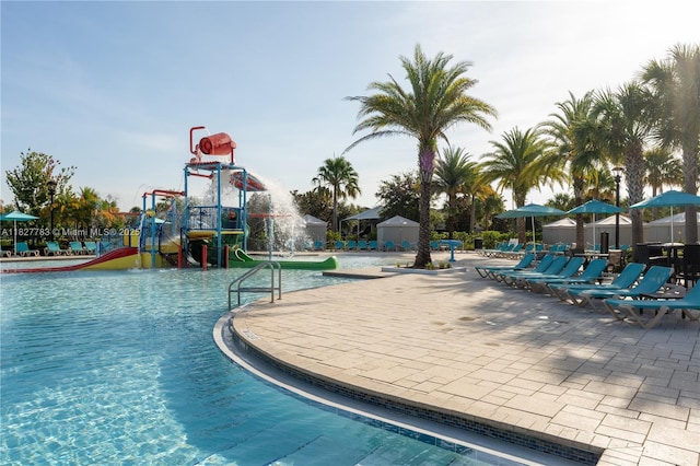 1892 Gobi Dr, Kissimmee, FL 3474 - community pool featuring a water play area and a patio area