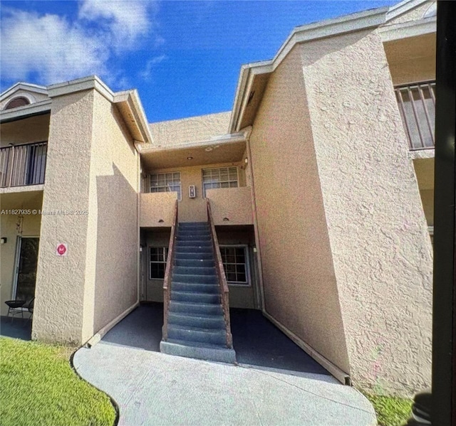 2331 NW 96th Ter Unit 17F, Pembroke Pines, FL 33024 - doorway to property with stucco siding