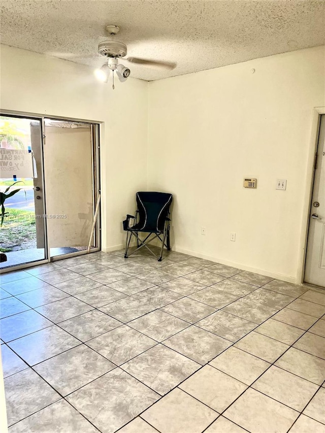 2331 NW 96th Ter Unit 17F, Pembroke Pines, FL 33024 - unfurnished room featuring a textured ceiling, light tile patterned floors, and a ceiling fan