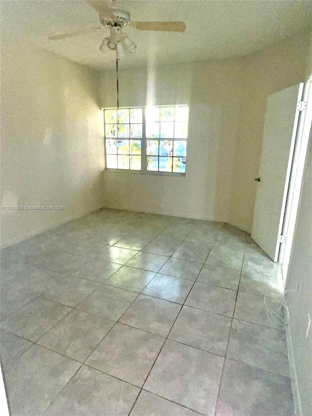 2331 NW 96th Ter Unit 17F, Pembroke Pines, FL 33024 - unfurnished room featuring tile patterned flooring and a ceiling fan