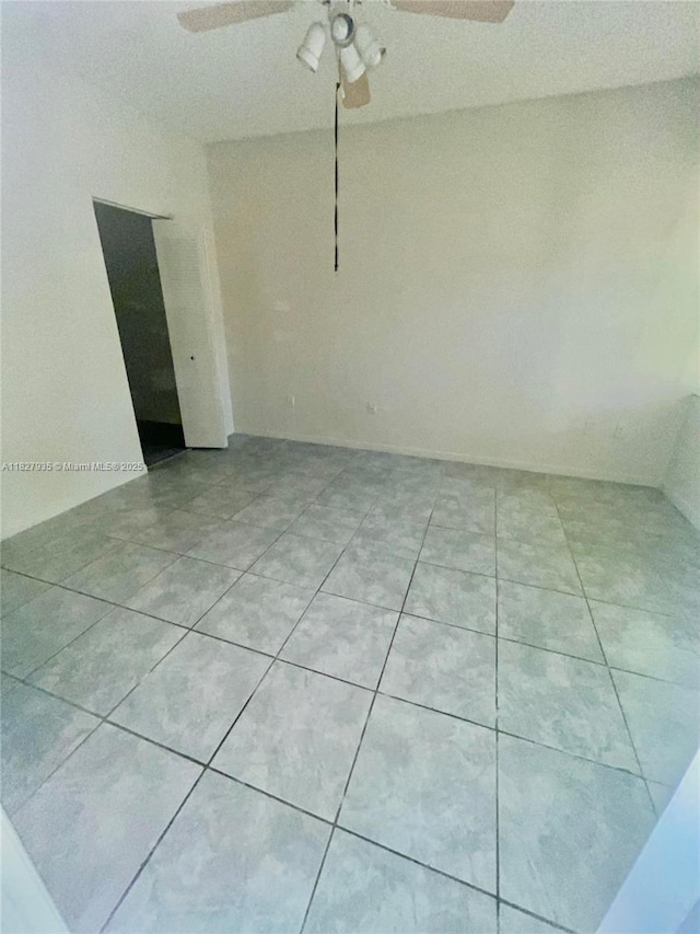 2331 NW 96th Ter Unit 17F, Pembroke Pines, FL 33024 - empty room with ceiling fan and light tile patterned floors