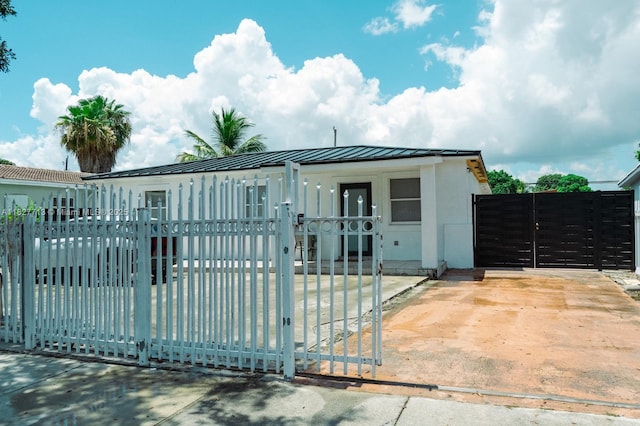 90 E 41st St, Hialeah, FL 33013 - gate featuring a fenced front yard
