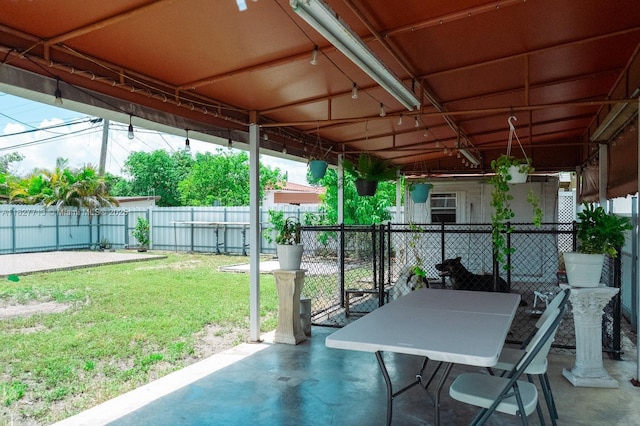 90 E 41st St, Hialeah, FL 33013 - fenced backyard featuring a patio and outdoor dining area