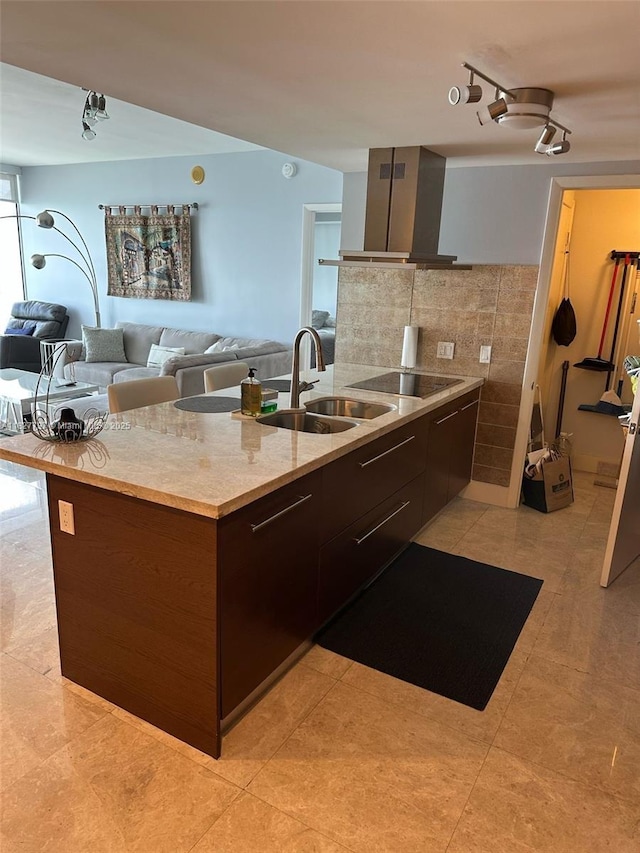 495 Brickell Ave Unit 5211, Miami, FL 33131 - kitchen featuring wall chimney range hood, modern cabinets, black electric cooktop, and open floor plan