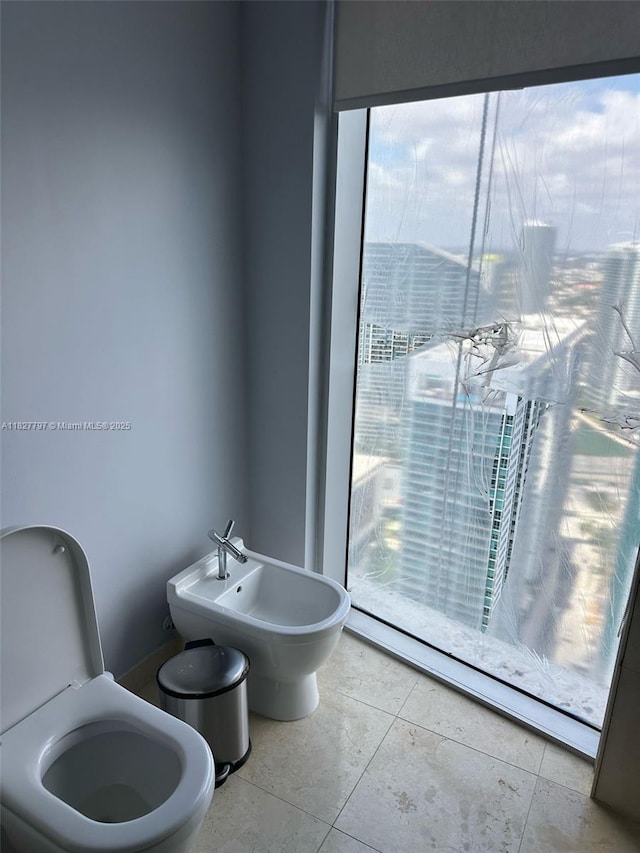 495 Brickell Ave Unit 5211, Miami, FL 33131 - bathroom with a bidet and tile patterned floors