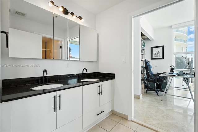 31 SE 5th St Unit 4021, Miami, FL 33131 - bathroom featuring double vanity and tile patterned floors