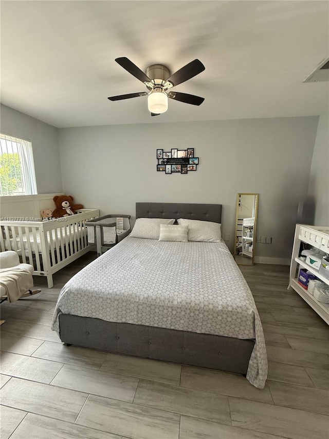17425 NW 67th Pl Unit F-13, Hialeah, FL 33015 - bedroom with ceiling fan and wood finished floors