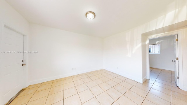1190 NW 65th St, Miami, FL 33150 - unfurnished room featuring light tile patterned floors and baseboards