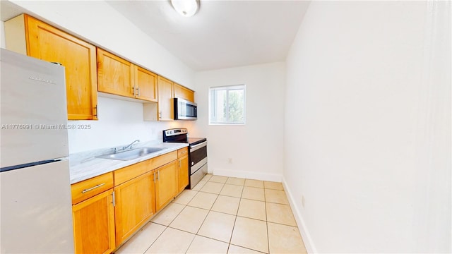 1190 NW 65th St, Miami, FL 33150 - kitchen featuring stainless steel appliances, light countertops, and light tile patterned floors