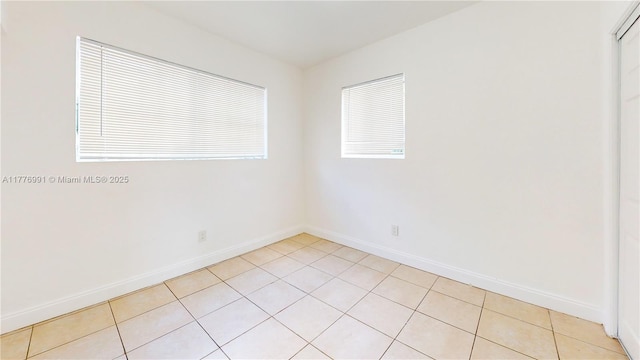 1190 NW 65th St, Miami, FL 33150 - unfurnished room featuring baseboards and light tile patterned floors