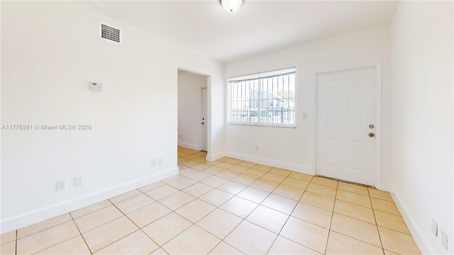 1190 NW 65th St, Miami, FL 33150 - empty room with light tile patterned floors and baseboards