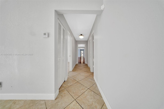1115 NE 1st Ct Unit A, Hallandale Beach, FL 33009 - hallway with light tile patterned floors and baseboards