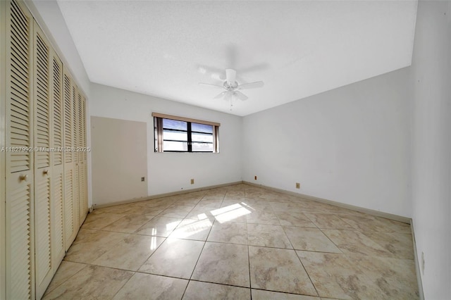 1115 NE 1st Ct Unit A, Hallandale Beach, FL 33009 - unfurnished bedroom with a closet, a ceiling fan, and light tile patterned floors