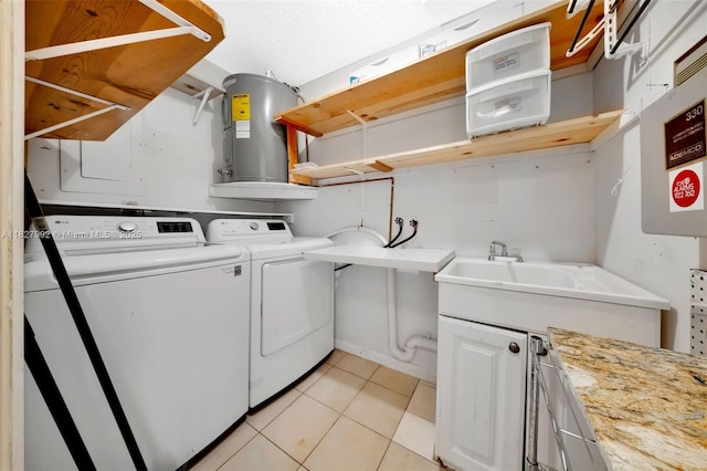1115 NE 1st Ct Unit A, Hallandale Beach, FL 33009 - washroom with washer and clothes dryer and light tile patterned floors