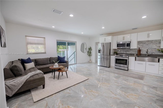 2125 SW 26th St, Miami, FL 33133 - living room featuring light marble finish flooring and recessed lighting