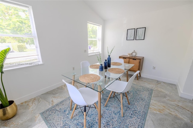 2125 SW 26th St, Miami, FL 33133 - dining area featuring vaulted ceiling and baseboards