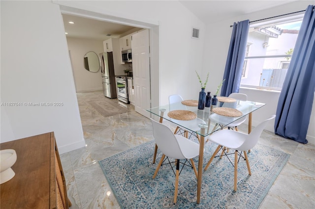 2125 SW 26th St, Miami, FL 33133 - dining space featuring light marble finish floors and baseboards