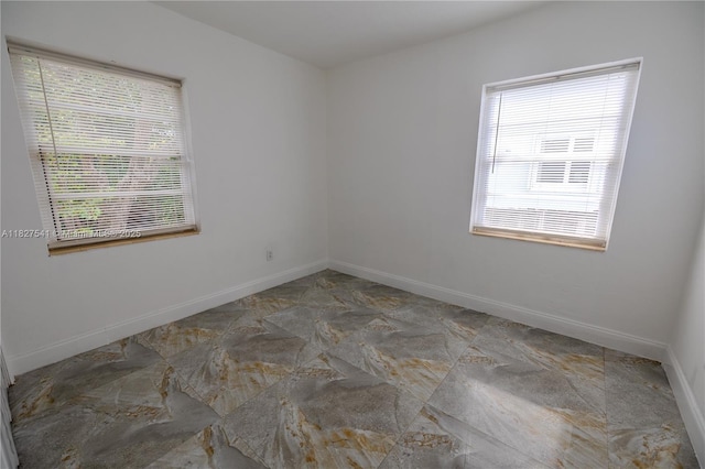 2125 SW 26th St, Miami, FL 33133 - spare room featuring baseboards