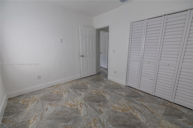 2125 SW 26th St, Miami, FL 33133 - unfurnished bedroom with baseboards and a closet