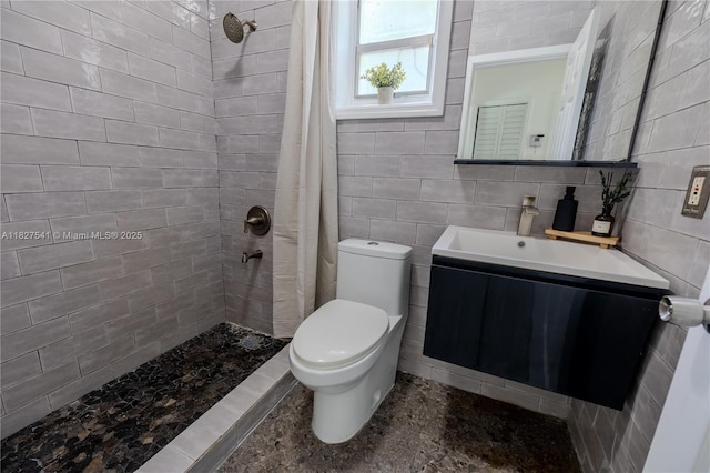 2125 SW 26th St, Miami, FL 33133 - full bathroom featuring a tile shower, vanity, and tile walls