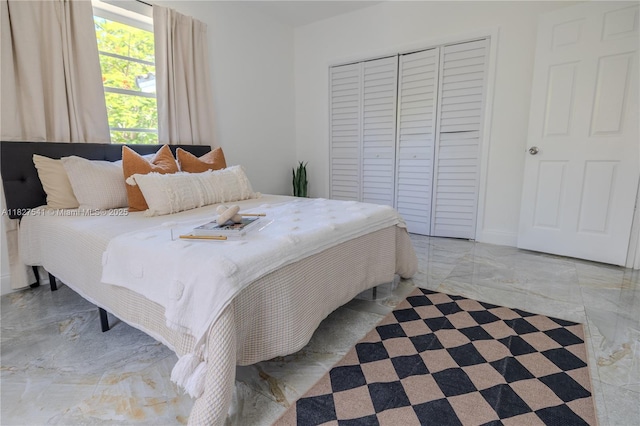 2125 SW 26th St, Miami, FL 33133 - bedroom featuring a closet and light marble finish floors