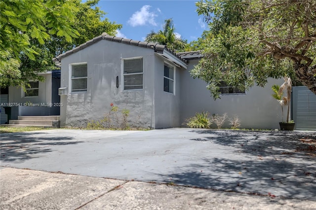 2125 SW 26th St, Miami, FL 33133 - view of home's exterior with stucco siding and a tile roof