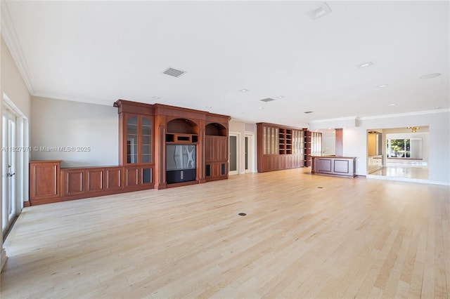1375 N Biscayne Point Rd, Miami Beach, FL 33141 - unfurnished living room with light wood-style flooring, ornamental molding, and a decorative wall