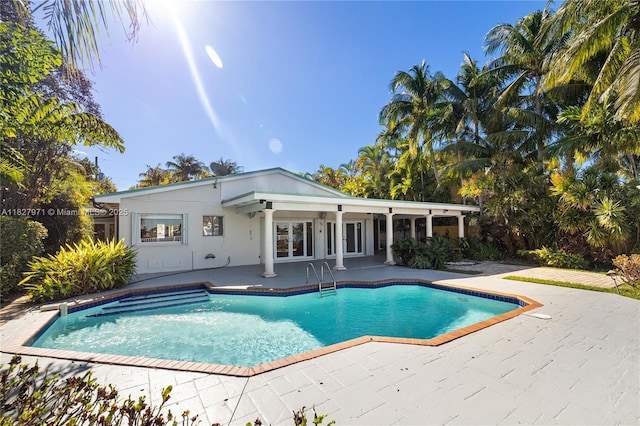 1375 N Biscayne Point Rd, Miami Beach, FL 33141 - swimming pool with french doors and a patio