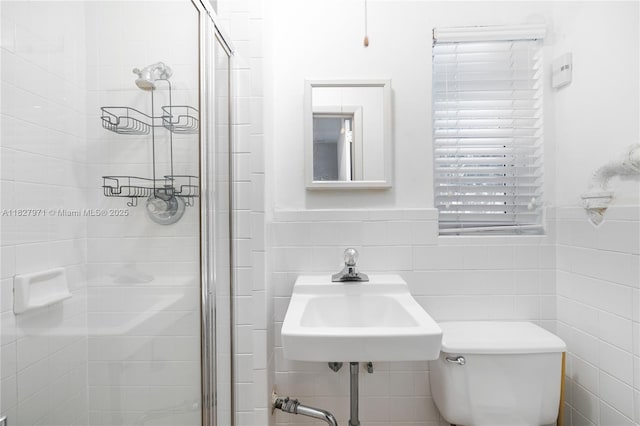 1375 N Biscayne Point Rd, Miami Beach, FL 33141 - full bath featuring tile walls, a stall shower, and a wainscoted wall