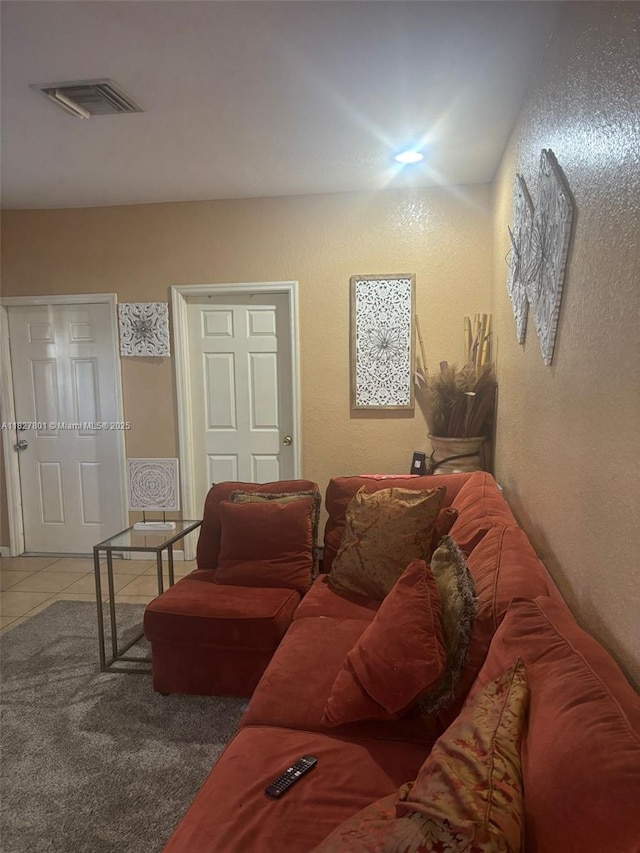 330 N Deerfield Ave, Deerfield Beach, FL 33441 - living room featuring tile patterned floors and a textured wall