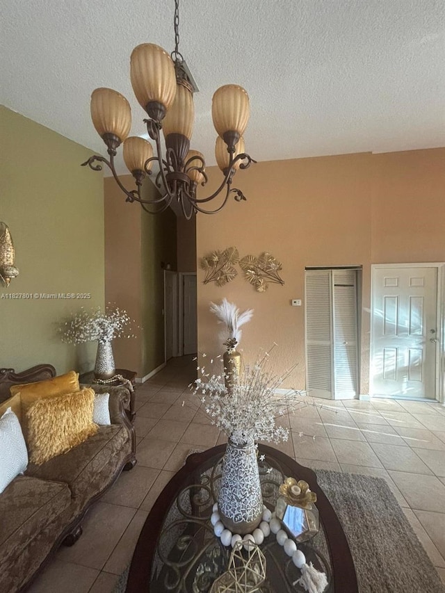 330 N Deerfield Ave, Deerfield Beach, FL 33441 - dining space with tile patterned floors, a textured ceiling, and a chandelier