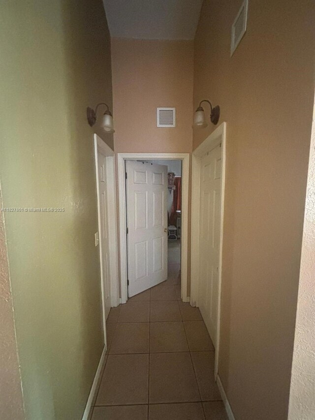 330 N Deerfield Ave, Deerfield Beach, FL 33441 - hallway featuring tile patterned floors and baseboards