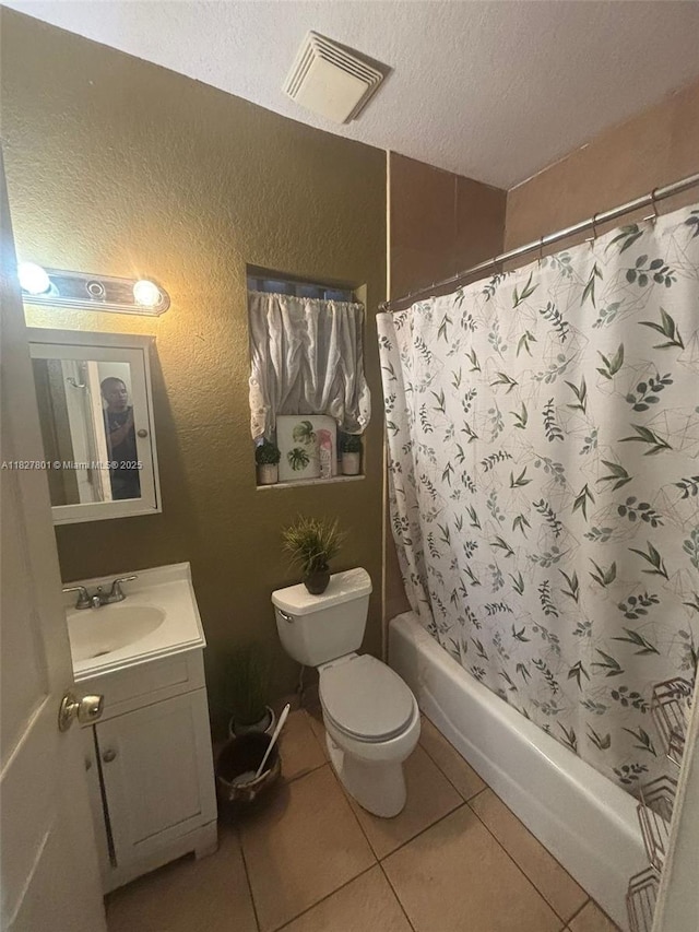 330 N Deerfield Ave, Deerfield Beach, FL 33441 - full bathroom with a textured ceiling, vanity, tile patterned floors, a textured wall, and shower / tub combo