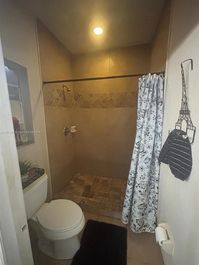 330 N Deerfield Ave, Deerfield Beach, FL 33441 - bathroom featuring tiled shower, tile patterned flooring, and recessed lighting