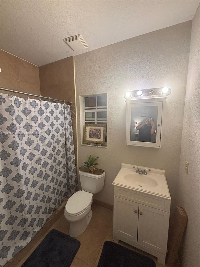 330 N Deerfield Ave, Deerfield Beach, FL 33441 - bathroom featuring vanity, tile patterned flooring, a shower with shower curtain, and a textured ceiling