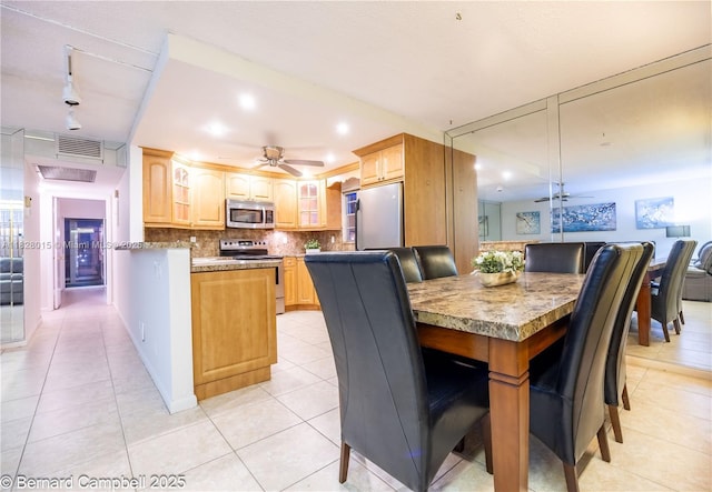 3021 Ventnor H Unit 3021, Deerfield Beach, FL 33442 - dining room featuring ceiling fan, light tile patterned flooring, track lighting, and recessed lighting