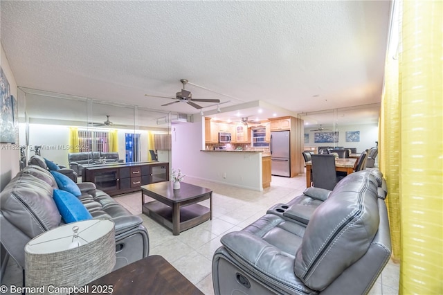3021 Ventnor H Unit 3021, Deerfield Beach, FL 33442 - living room with a ceiling fan, light tile patterned floors, and a textured ceiling
