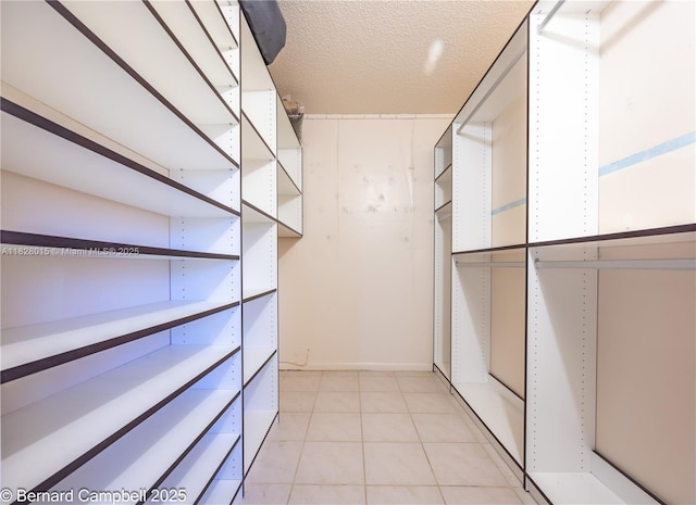 3021 Ventnor H Unit 3021, Deerfield Beach, FL 33442 - walk in closet featuring light tile patterned floors
