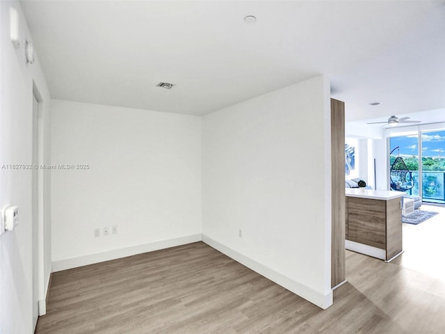 16385 Biscayne Blvd Unit 403, North Miami Beach, FL 33160 - unfurnished room with light wood-style flooring and a ceiling fan