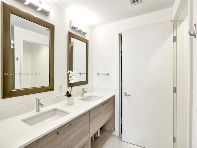 16385 Biscayne Blvd Unit 403, North Miami Beach, FL 33160 - bathroom featuring marble finish floors and double vanity